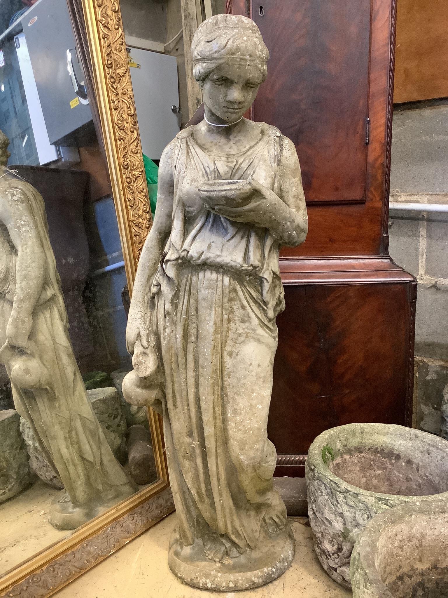 A reconstituted stone garden ornament of a lady with ewer, height 100cm